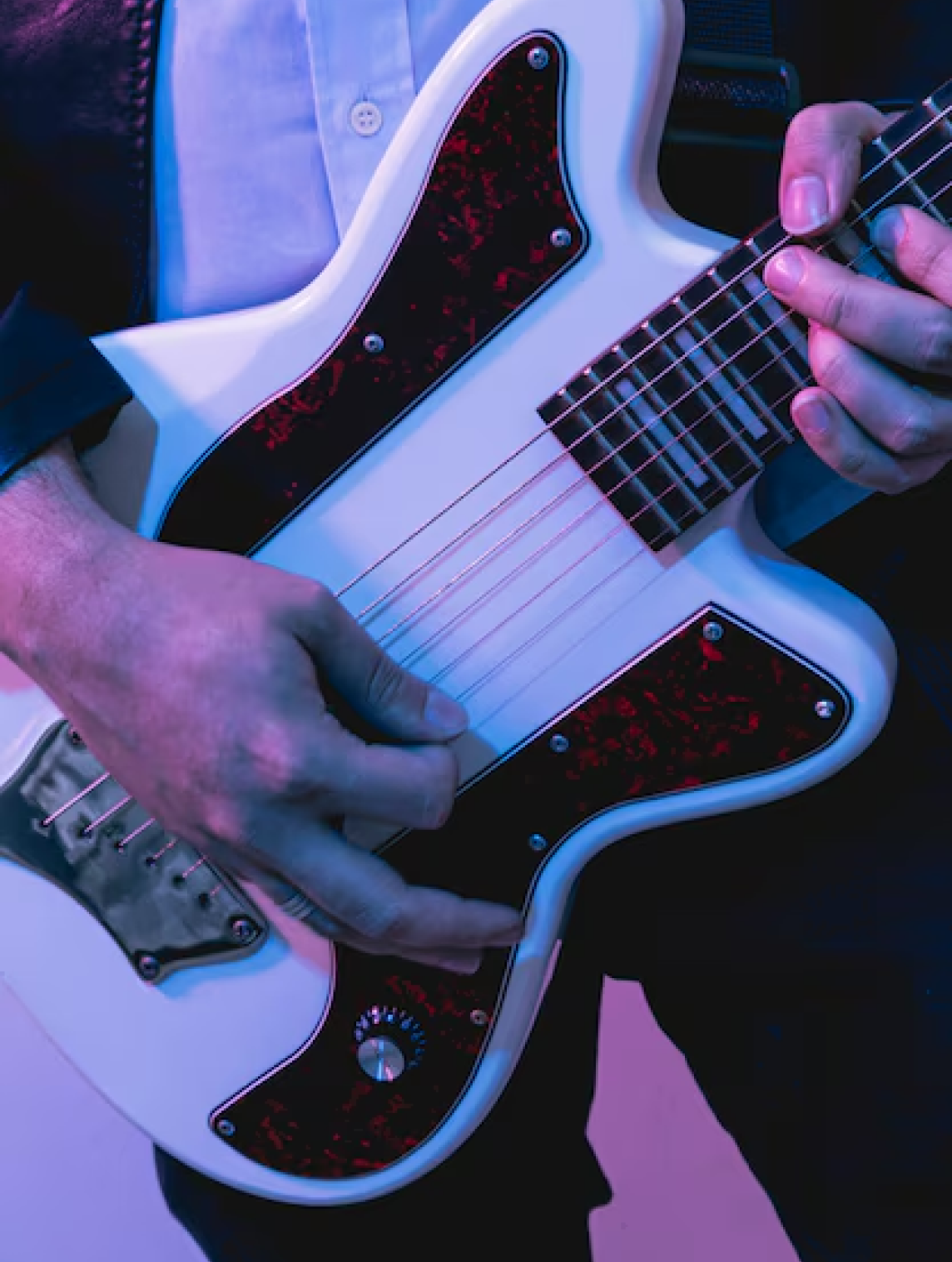 Electric guitar with purple lighting